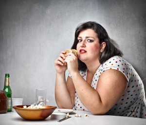 bigstock-Fat-woman-feeling-guilty-while-21341984-300x256