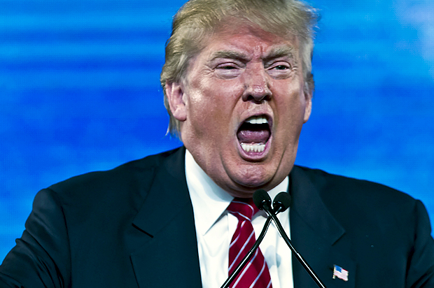 Republican Presidential candidate Trump reacts as he speaks at the 2015 FreedomFest in Las Vegas
